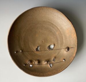 Large round ceramic wall sculpture by artist, Peter Voulkos (1924-2002).