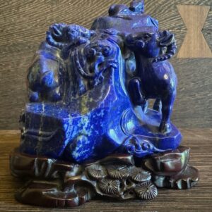 Chinese antique lapis carving of rams on rock formation