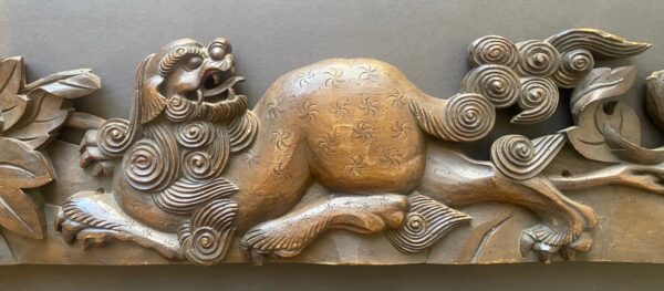 Antique Japanese temple carving of a shishi (fu-dog) and peonies