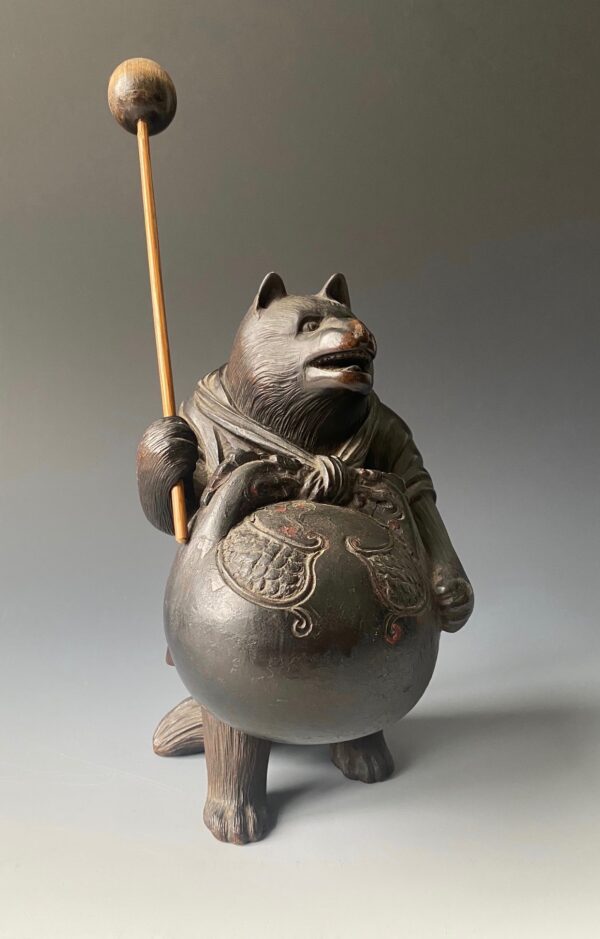 Japanese antique carved boxwood figure of Soko-tanuki. Here he is disguised as a monk