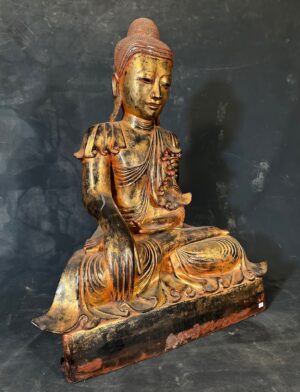 Buddha dry lacquer statue. Black lacquer with gold gilt and traces of red lacquer.