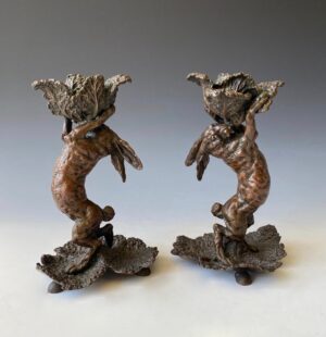 Pair of antique bronze candlesticks.