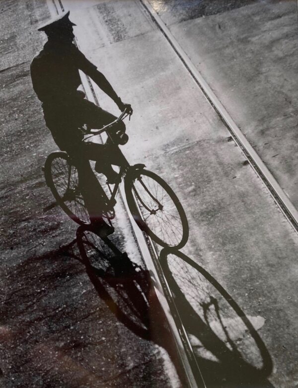 Fan Ho photograph of man on bicycle