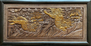 Chinese antique carved panel with fu-lions.