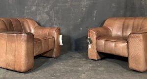 Pair of De Sede DS-44 leather club chairs. Buff color with 7" extension. Switzerland.