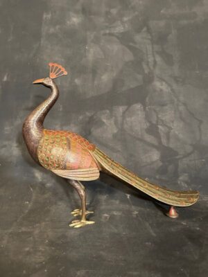A bronze peacock figure with fine incised detail to the feathers with rich enamel colors
