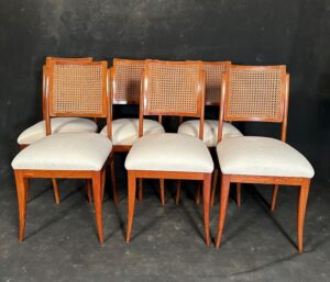 A set of 6 mid century modern (MCM) double cane back dining chairs with overstuffed seats. Made by Rachid Ismael Assan through his company Fabrica de Moveis Brasil.